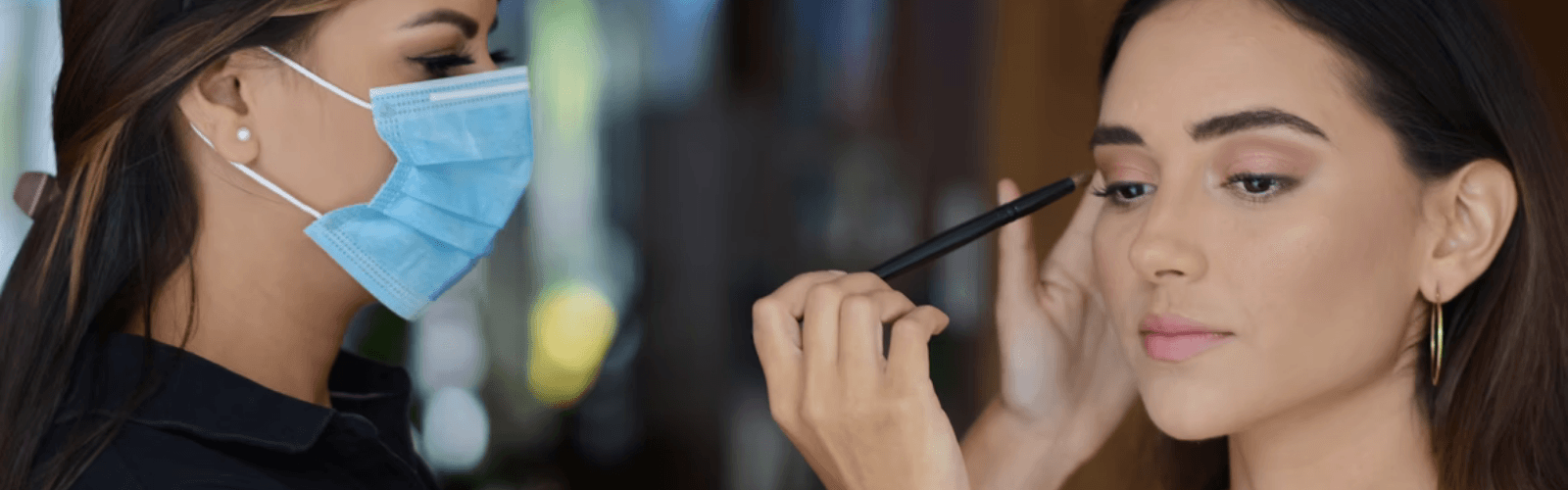 makeup artist using a eyeliner